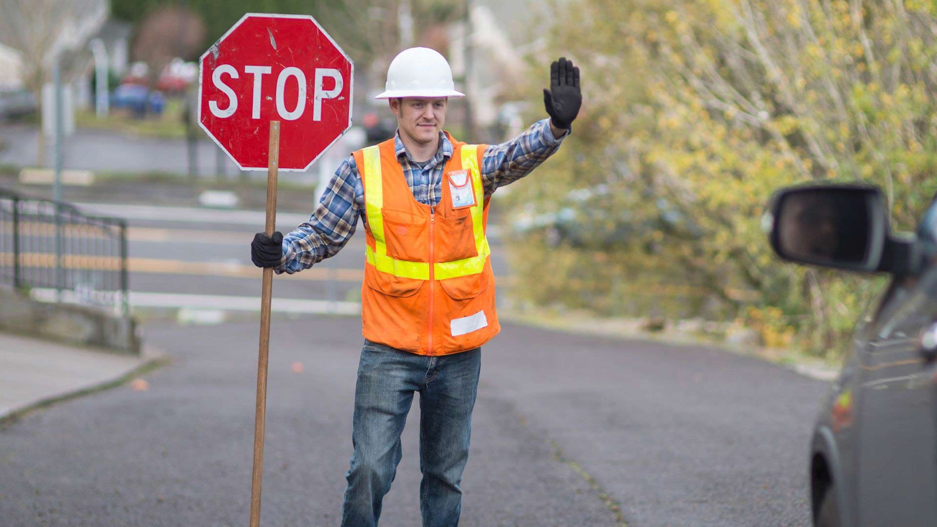flagger holding stop sign
