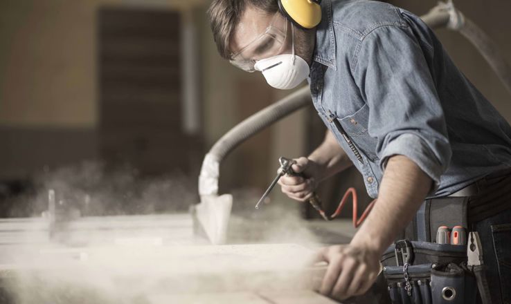 Carpenter working with a sander