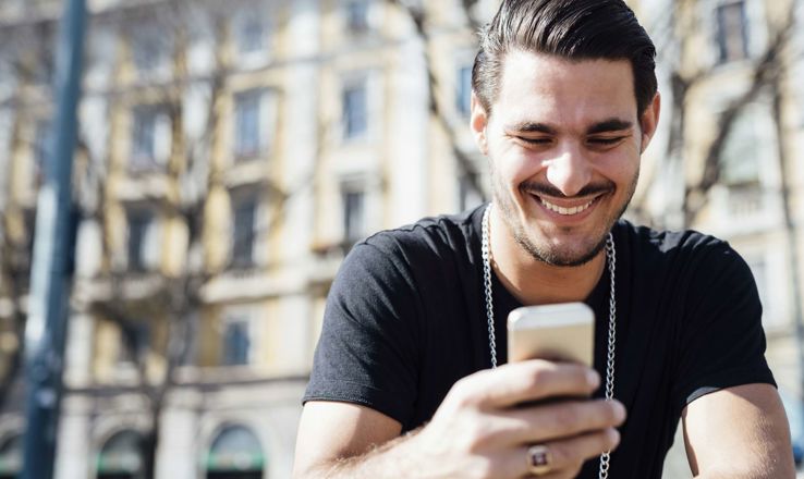 Happy guy on his phone